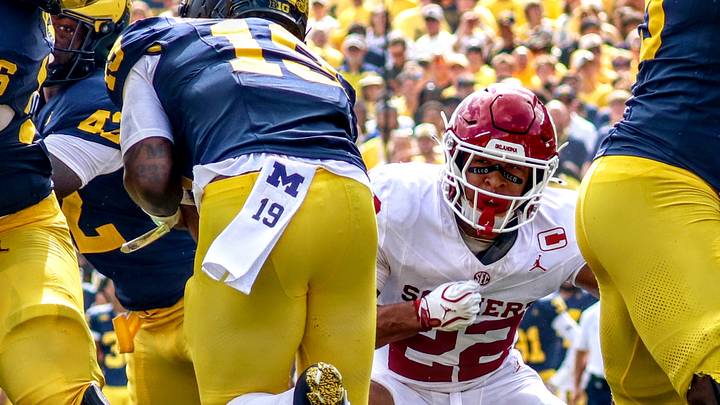 Oklahoma defensive back Peyton Bowen tries to make a tackle against Michigan. Oklahoma defensive back Peyton Bowen tries to make a tackle against Michigan.