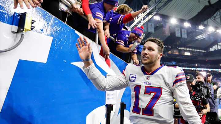 Buffalo Bills quarterback Josh Allen (17) high fives fans after the Bills defeated the Detroit Lions 28-25 at Ford Field in Detroit on Thursday, Nov. 24, 2022.