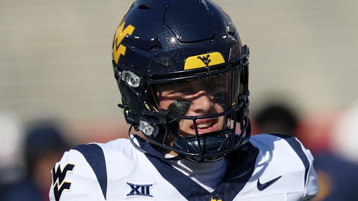 Nov 1, 2025; Houston, Texas, USA; West Virginia Mountaineers quarterback Scotty Fox Jr. (15) warms up before playing against the Houston Cougars  at TDECU Stadium. Mandatory Credit: Thomas Shea-Imagn Images