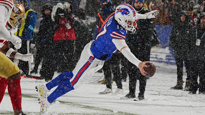 Bills Josh Allen leaps to the end zone in a nine-yard touchdown run after getting the ball passed back to him from Amari Cooper during second half action of their home game against the San Francisco 49ers in Orchard Park on Dec. 1, 2024. Bills Josh Allen leaps to the end zone in a nine-yard touchdown run after getting the ball passed back to him from Amari Cooper during second half action of their home game against the San Francisco 49ers in Orchard Park on Dec. 1, 2024.