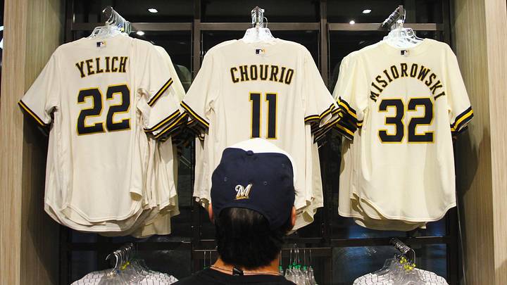 A fan browses jerseys for Christian Yelich, Jackson Chourio and Jacob Misiorowski in the Milwaukee Brewers team store at American Family Field.