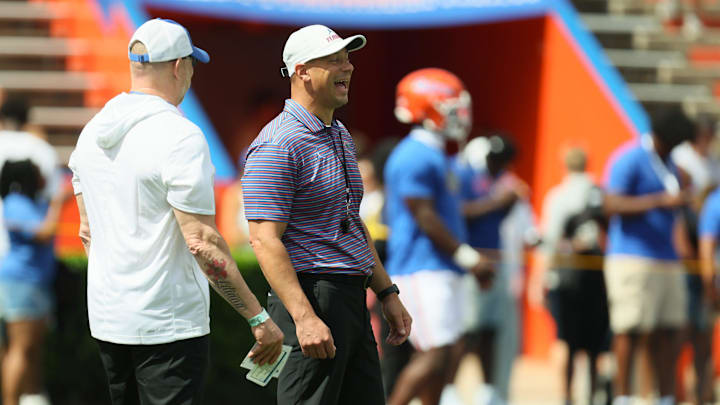 Florida head coach Jon Sumrall enjoys a laugh before the Orange and Blue game at Steve Spurrier Field at Ben Hill Griffin Stadium in Gainesville, FL on Saturday, April 11, 2026. [Alan Youngblood/Gainesville Sun]