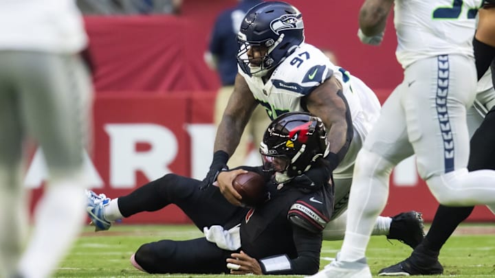 Dec 8, 2024; Glendale, Arizona, USA; Arizona Cardinals quarterback Kyler Murray (1) is sacked by Seattle Seahawks defensive tackle Johnathan Hankins (97) in the first half at State Farm Stadium. Dec 8, 2024; Glendale, Arizona, USA; Arizona Cardinals quarterback Kyler Murray (1) is sacked by Seattle Seahawks defensive tackle Johnathan Hankins (97) in the first half at State Farm Stadium.