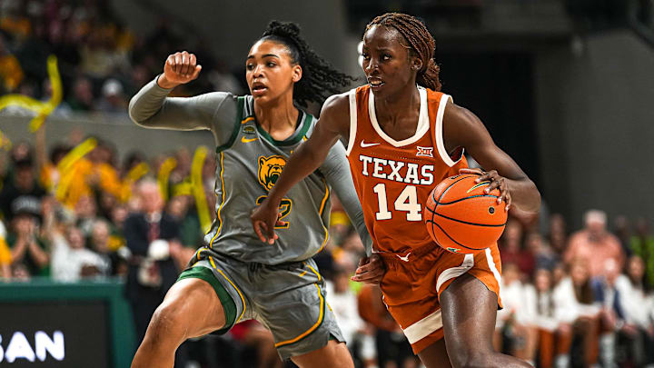 Texas Longhorns forward Amina Muhammad (14) pushes past Baylor guard Bella Fontleroy (22) during the