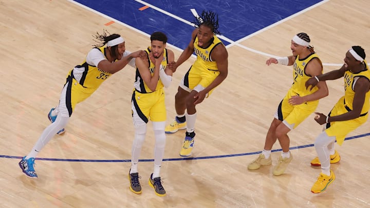 Indiana Pacers guard Tyrese Haliburton (0) celebrates with teammates after tying the game in the fourth quarter to send the game to overtime against the New York Knicks during game one of the eastern conference finals for the 2025 NBA Playoffs at Madison Square Garden. Mandatory Credit: Brad Penner-Imagn Images Indiana Pacers guard Tyrese Haliburton (0) celebrates with teammates after tying the game in the fourth quarter to send the game to overtime against the New York Knicks during game one of the eastern conference finals for the 2025 NBA Playoffs at Madison Square Garden. Mandatory Credit: Brad Penner-Imagn Images