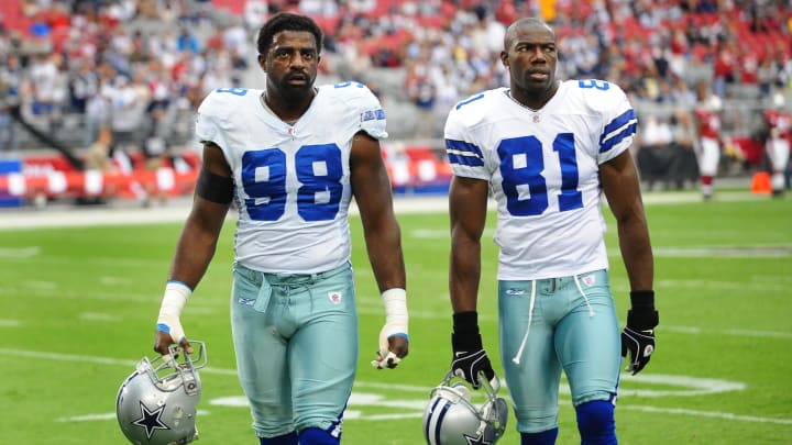 Dallas Cowboys linebacker (98) Greg Ellis and wide receiver (81) Terrell Owens against the Arizona Cardinals at University of Phoenix Stadium. Arizona defeated Dallas 30-24 in overtime. Dallas Cowboys linebacker (98) Greg Ellis and wide receiver (81) Terrell Owens against the Arizona Cardinals at University of Phoenix Stadium. Arizona defeated Dallas 30-24 in overtime.