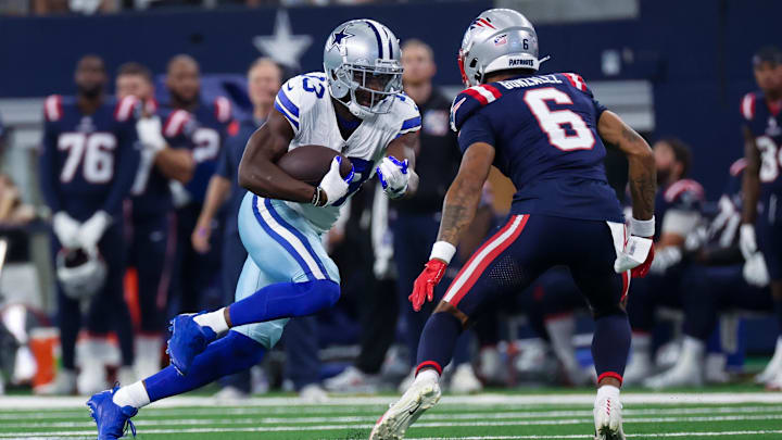 Oct 1, 2023; Arlington, Texas, USA; Dallas Cowboys wide receiver Michael Gallup (13) runs with the ball as New England Patriots cornerback Christian Gonzalez (6) defends during the first quarter at AT&T Stadium. Mandatory Credit: Kevin Jairaj-USA TODAY Sports