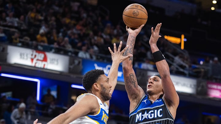 Dec 31, 2025; Indianapolis, Indiana, USA;  Orlando Magic forward Paolo Banchero (5) shoots the ball while Indiana Pacers center/forward Tony Bradley (13) defends in the second half at Gainbridge Fieldhouse. Mandatory Credit: Trevor Ruszkowski-Imagn Images