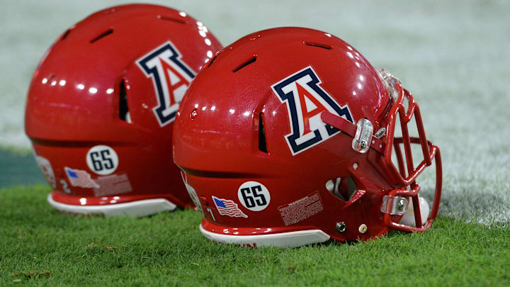 Sep 3, 2016; Glendale, AZ, USA; Stickers on the helmets of Arizona Wildcats platers depict depict the number 65 for deceased player Zach Hemmila (not pictured) prior to the game against the Brigham Young Cougars at University of Phoenix Stadium. Mandatory Credit: Joe Camporeale-Imagn Images Sep 3, 2016; Glendale, AZ, USA; Stickers on the helmets of Arizona Wildcats platers depict depict the number 65 for deceased player Zach Hemmila (not pictured) prior to the game against the Brigham Young Cougars at University of Phoenix Stadium. Mandatory Credit: Joe Camporeale-Imagn Images