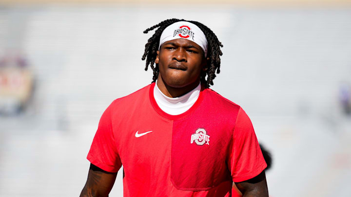 Ohio State Buckeyes wide receiver Jeremiah Smith (4) warms-up before the game against the Wisconsin Badgers at Camp Randall Stadium.