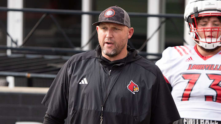 University of Louisville offensive line coach Richard Owens runs a drill during their second practice on Friday, Aug. 2, 2024 at L&N Federal Credit Union Stadium.