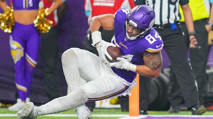 Nov 3, 2024; Minneapolis, Minnesota, USA; Minnesota Vikings tight end Josh Oliver (84) catches a pass for a touchdown against the Indianapolis Colts in the fourth quarter at U.S. Bank Stadium. Nov 3, 2024; Minneapolis, Minnesota, USA; Minnesota Vikings tight end Josh Oliver (84) catches a pass for a touchdown against the Indianapolis Colts in the fourth quarter at U.S. Bank Stadium.