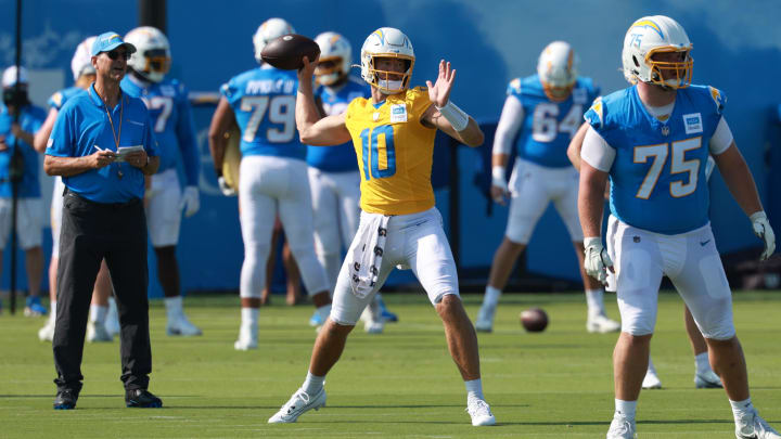 Jul 24, 2024; El Segundo, CA, USA; Los Angeles Chargers quarterback Justin Herbert (10) throws during the first day of training camp at The Bolt. Jul 24, 2024; El Segundo, CA, USA; Los Angeles Chargers quarterback Justin Herbert (10) throws during the first day of training camp at The Bolt.