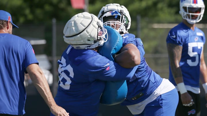 Buffalo Bills rookie defensive tackles T.J. Sanders, right, and Deone Walker lock up during drills during Bills training camp.
