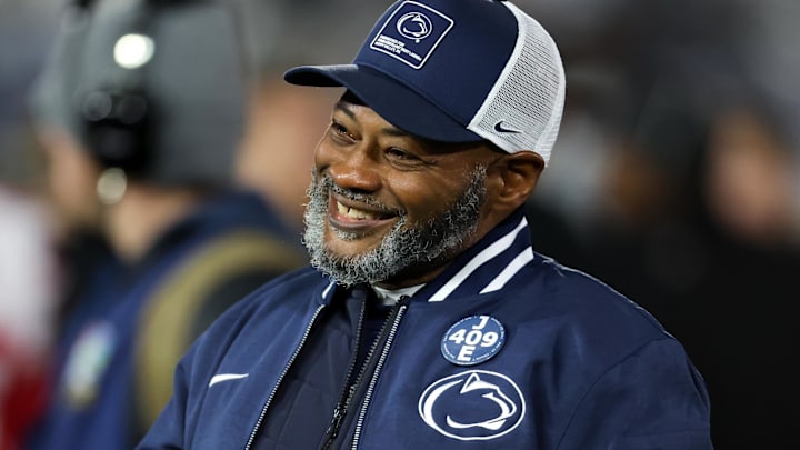 Nov 22, 2025; University Park, Pennsylvania, USA; Penn State Nittany Lions interim head coach Terry Smith walks on the field during a warm up prior to the game against the Nebraska Cornhuskers at Beaver Stadium. Mandatory Credit: Matthew O'Haren-Imagn Images