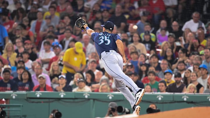 Seattle Mariners first baseman Jason Vosler (35) can't make the catch at first base during the fifth inning against the Boston Red Sox at Fenway Park on July 29.