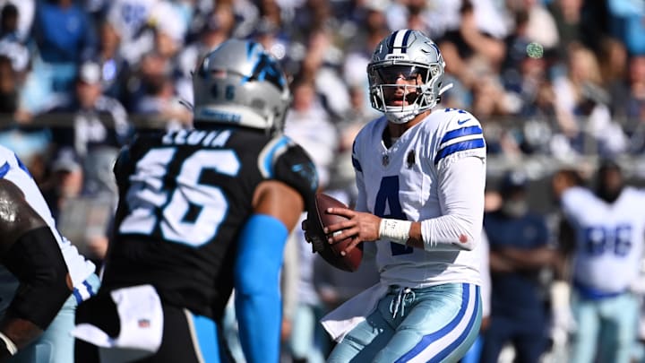 Dallas Cowboys quarterback Dak Prescott looks to pass as Carolina Panthers linebacker Eku Leota Dallas Cowboys quarterback Dak Prescott looks to pass as Carolina Panthers linebacker Eku Leota