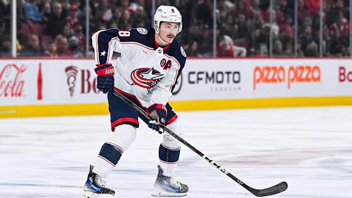Nov 16, 2024; Montreal, Quebec, CAN; Columbus Blue Jackets defenseman Zach Werenski (8) plays the puck against the Montreal Canadiens during the first period at Bell Centre. Mandatory Credit: David Kirouac-Imagn Images
