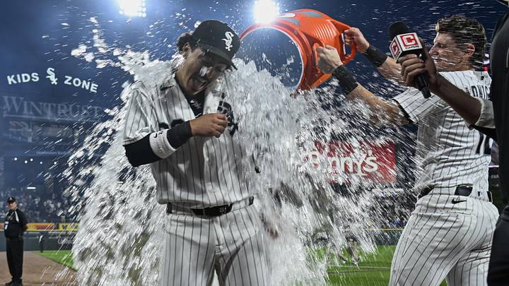 Jun 23, 2026; Chicago, Illinois, USA;  Chicago White Sox third baseman Miguel Vargas (20) gets doused by second baseman Chase Meidroth (10) after the game against the Cleveland Guardians at Rate Field. Mandatory Credit: Matt Marton-Imagn Images