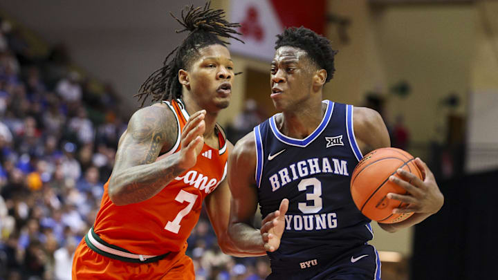 Nov 27, 2025; Kissimmee, Florida, USA; Brigham Young University Cougars forward AJ Dybantsa (3) is guarded by Miami (FL) Hurricanes forward Shelton Henderson (7) in the second half at State Farm Field House. Mandatory Credit: Nathan Ray Seebeck-Imagn Images