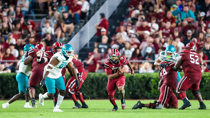 Nov 22, 2025; Columbia, South Carolina, USA; South Carolina Gamecocks quarterback Lanorris Sellers (16) scrambles against the Coastal Carolina Chanticleers in the second half at Williams-Brice Stadium. Mandatory Credit: Jeff Blake-Imagn Images