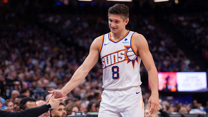 Apr 12, 2024; Sacramento, California, USA; Phoenix Suns guard Grayson Allen (8) high fives coaches as he comes out of the game during the second quarter at Golden 1 Center. Mandatory Credit: Ed Szczepanski-Imagn Images