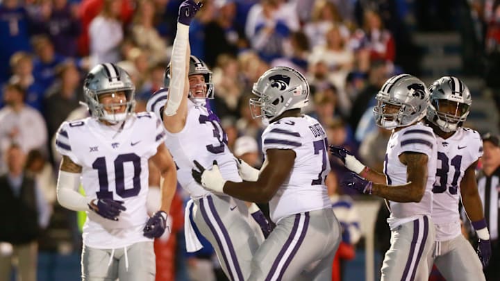 Kansas State junior tight end Ben Sinnott (34) celebrates a touchdown during the first quarter of Saturday's Sunflower Showdown against Kansas inside David Booth Kansas Memorial Stadium.