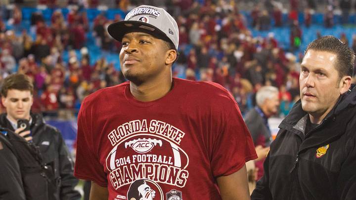 Dec 6, 2014; Charlotte, NC, USA; Florida State Seminoles quarterback Jameis Winston (5) walks off the field after defeating the Georgia Tech Yellow Jackets at Bank of America Stadium. FSU defeated Georgia Tech 37-35. Mandatory Credit: Jeremy Brevard-Imagn Images