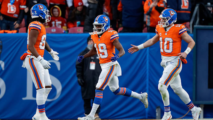 Jan 5, 2025; Denver, Colorado, USA; Denver Broncos wide receiver Marvin Mims Jr. (19) celebrates his touchdown with wide receiver Lil'Jordan Humphrey (84) and quarterback Bo Nix (10) in the third quarter against the Kansas City Chiefs at Empower Field at Mile High. Mandatory Credit: Isaiah J. Downing-Imagn Images