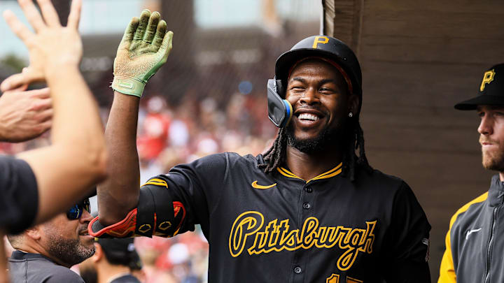 Cincinnati, Ohio, USA; Pittsburgh Pirates outfielder Oneil Cruz (15) high fives teammates after hitting a solo home run in the first inning against the Cincinnati at Great American Ball Park.