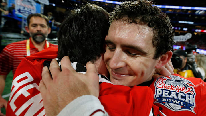 Georgia quarterback Stetson Bennett (13) hugs his brother Georgia walk-on Luke Bennett (29) after the Chick-fil-A Peach Bowl NCAA College Football Playoff semifinal game between Ohio State and Georgia on Sunday, Jan 1, 2022, in Atlanta. Georgia won 42-41.

News Joshua L Jones