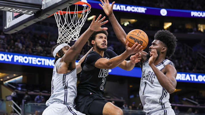 Dec 29, 2024; Orlando, Florida, USA; Orlando Magic forward Jonathan Isaac (1) and center Wendell Carter Jr. (34) block a shot by Brooklyn Nets forward Cameron Johnson (2) during the second quarter at Kia Center. Mandatory Credit: Mike Watters-Imagn Images