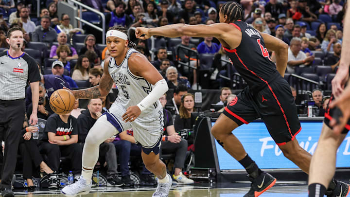 Mar 4, 2025; Orlando, Florida, USA; Orlando Magic forward Paolo Banchero (5) drives to the basket against Toronto Raptors forward Scottie Barnes (4) during the first quarter at Kia Center. Mandatory Credit: Mike Watters-Imagn Images Mar 4, 2025; Orlando, Florida, USA; Orlando Magic forward Paolo Banchero (5) drives to the basket against Toronto Raptors forward Scottie Barnes (4) during the first quarter at Kia Center. Mandatory Credit: Mike Watters-Imagn Images