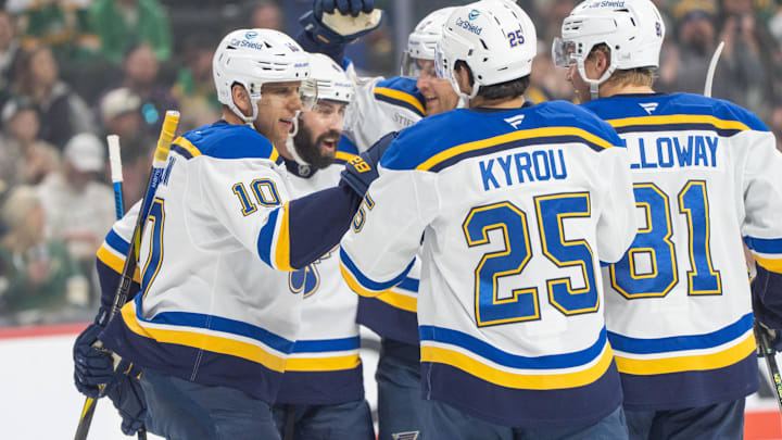 Mar 15, 2025; Saint Paul, Minnesota, USA; St. Louis Blues center Brayden Schenn (10) is congratulated by teammates after scoring on the Minnesota Wild in the first period at Xcel Energy Center. Mandatory Credit: Matt Blewett-Imagn Images