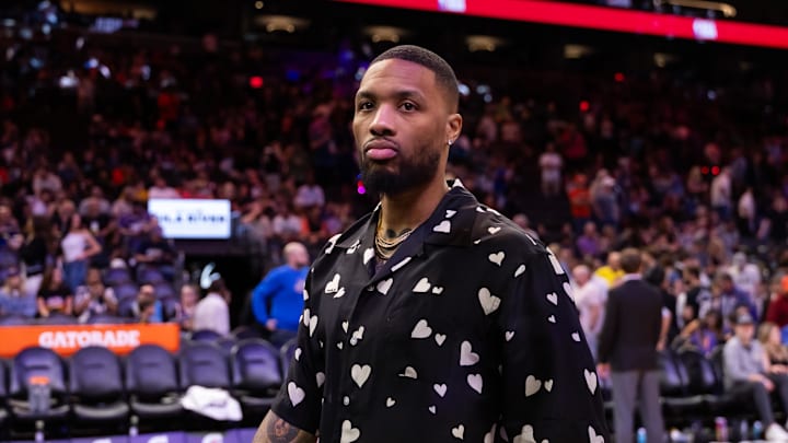 Mar 24, 2025; Phoenix, Arizona, USA; Milwaukee Bucks injured guard Damian Lillard against the Phoenix Suns at Footprint Center. Mandatory Credit: Mark J. Rebilas-Imagn Images