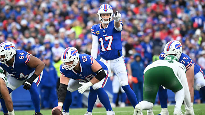 Dec 29, 2024; Orchard Park, New York, USA; Buffalo Bills quarterback Josh Allen (17) and guard Connor McGovern (66) at the line of scrimmage in the third quarter against the New York Jets at Highmark Stadium. Mandatory Credit: Mark Konezny-Imagn Images