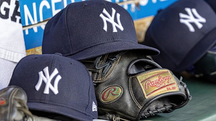 Apr 7, 2025; Detroit, Michigan, USA; New York Yankees baseball hats and gloves in the dugout out in the eighth inning against the Detroit Tigers at Comerica Park. Mandatory Credit: David Reginek-Imagn Images Apr 7, 2025; Detroit, Michigan, USA; New York Yankees baseball hats and gloves in the dugout out in the eighth inning against the Detroit Tigers at Comerica Park. Mandatory Credit: David Reginek-Imagn Images