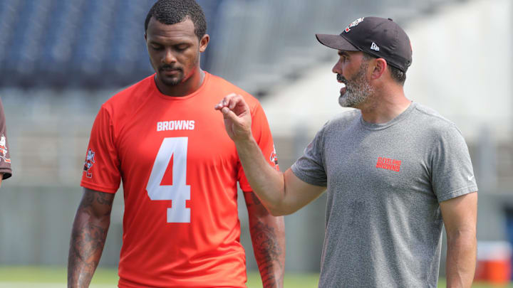 Quarterback Deshaun Watson, talking with coach Kevin Stefanski at a 2022 minicamp session, has only played in 19 of the Browns' 52 games since being acquired from the Texans in 2022.