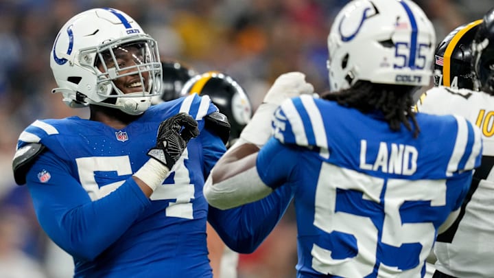 Indianapolis Colts defensive end Dayo Odeyingbo (54) and Indianapolis Colts defensive end Isaiah Land (55) celebrate a sack Sunday, Sept. 29, 2024, during a game against the Pittsburgh Steelers at Lucas Oil Stadium in Indianapolis.