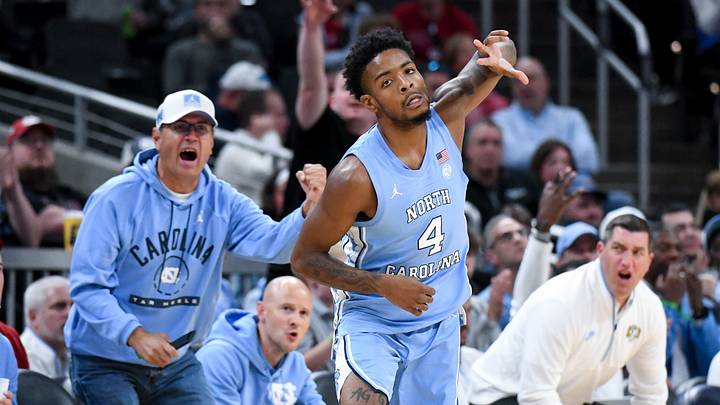 Oct 18, 2026; Indianapolis, IN, USA; North Carolina Tar Heels guard Jaydon Young (4) celebrates after making a three-pointer against the Indiana Hoosiers during the second half at Gainbridge Fieldhouse. Mandatory Credit: Robert Goddin-Imagn Images