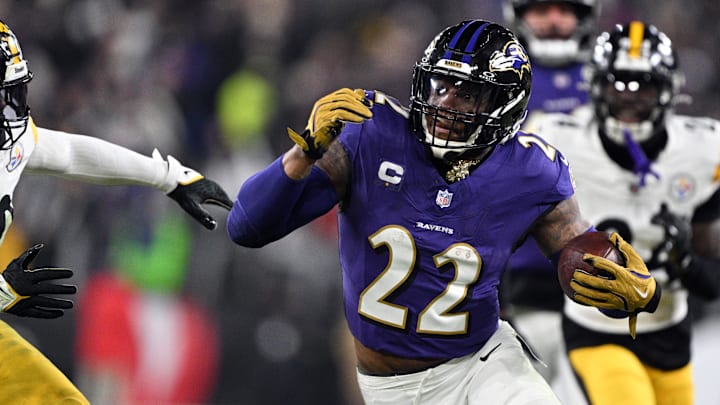 Baltimore Ravens running back Derrick Henry (22) runs against Pittsburgh Steelers linebacker Elandon Roberts (50) in the second quarter in an AFC wild card game at M&T Bank Stadium. Baltimore Ravens running back Derrick Henry (22) runs against Pittsburgh Steelers linebacker Elandon Roberts (50) in the second quarter in an AFC wild card game at M&T Bank Stadium.