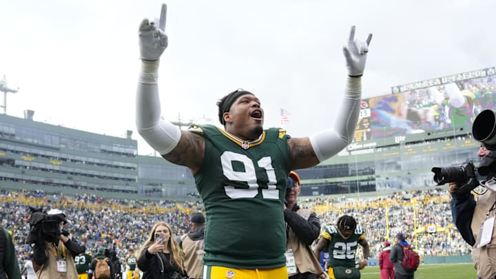 Oct 13, 2024; Green Bay, Wisconsin, USA;  Green Bay Packers defensive lineman Preston Smith (91) celebrates following the game against the Arizona Cardinals at Lambeau Field. Mandatory Credit: Jeff Hanisch-Imagn Images