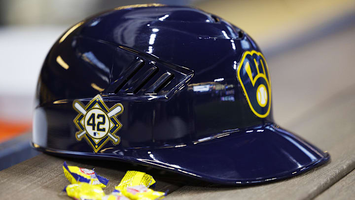 Apr 15, 2022; Milwaukee, Wisconsin, USA;  A Milwaukee Brewers batting helmet sits in the dugout showing the Jackie Robinson Number 42 prior to the game against the St. Louis Cardinals at American Family Field. Mandatory Credit: Jeff Hanisch-Imagn Images