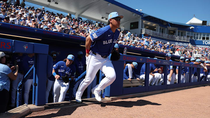 Feb 21, 2026; Dunedin, Florida, USA; Toronto Blue Jays third baseman Kazuma Okamoto (7) runs out onto the field  for the start of spring training games against the Philadelphia Phillies at TD Ballpark. Mandatory Credit: Kim Klement Neitzel-Imagn Images
