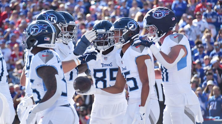 Oct 20, 2024; Orchard Park, New York, USA; Tennessee Titans wide receiver Nick Westbrook-Ikhine (15) celebrates scoring a touchdown against the Buffalo Bills in the second quarter at Highmark Stadium. Mandatory Credit: Mark Konezny-Imagn Images Oct 20, 2024; Orchard Park, New York, USA; Tennessee Titans wide receiver Nick Westbrook-Ikhine (15) celebrates scoring a touchdown against the Buffalo Bills in the second quarter at Highmark Stadium. Mandatory Credit: Mark Konezny-Imagn Images
