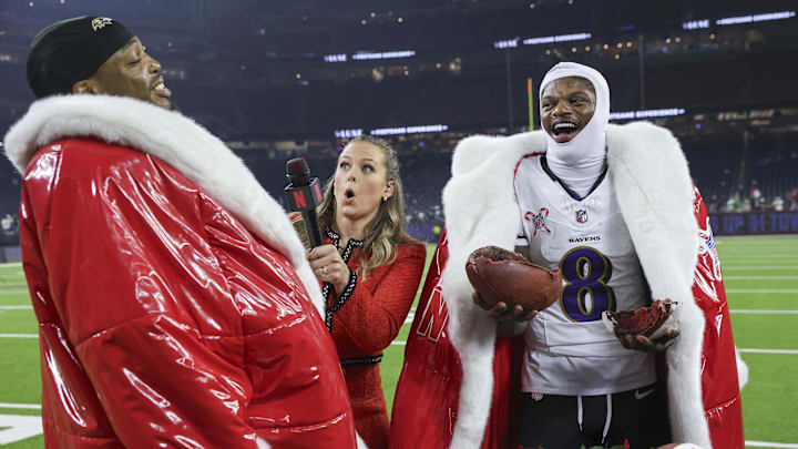 Baltimore Ravens quarterback Lamar Jackson (8) and running back Derrick Henry (22) wear Santa coats while being interviewed by Netflix host Jamie Erdahl after the game against the Houston Texans. Baltimore Ravens quarterback Lamar Jackson (8) and running back Derrick Henry (22) wear Santa coats while being interviewed by Netflix host Jamie Erdahl after the game against the Houston Texans.