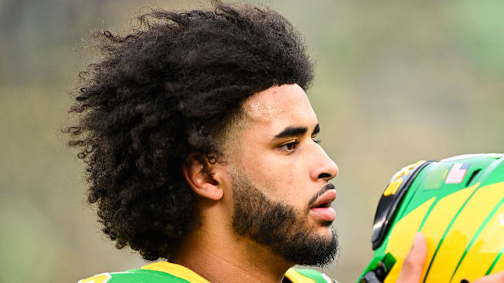 Dec 20, 2025; Eugene, OR, USA; Oregon Ducks quarterback Dante Moore (5) looks on before the game against the James Madison Dukes at Autzen Stadium. Mandatory Credit: Troy Wayrynen-Imagn Images