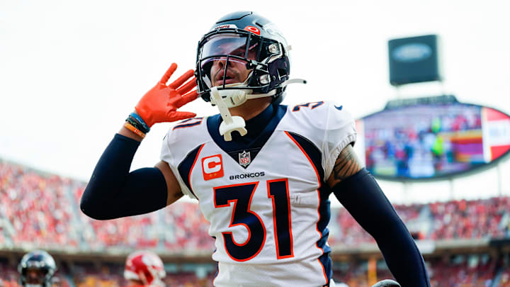 Jan 1, 2023; Kansas City, Missouri, USA; Denver Broncos safety Justin Simmons (31) celebrates after an interception during the first half against the Kansas City Chiefs at GEHA Field at Arrowhead Stadium. Mandatory Credit: Jay Biggerstaff-Imagn Images | Jay Biggerstaff-Imagn Images