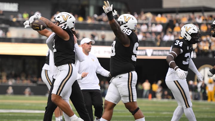 Oct 25, 2025; Nashville, Tennessee, USA; Vanderbilt Commodores defensive players celebrate after a goal-line stand against the Missouri Tigers during the third quarter at FirstBank Stadium. Mandatory Credit: Steve Roberts-Imagn Images