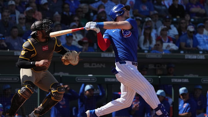 Mar 4, 2025; Mesa, Arizona, USA; Chicago Cubs outfielder Kyle Tucker (30) hits an RBI sacrifice fly out against the San Diego Padres in the third inning at Sloan Park.